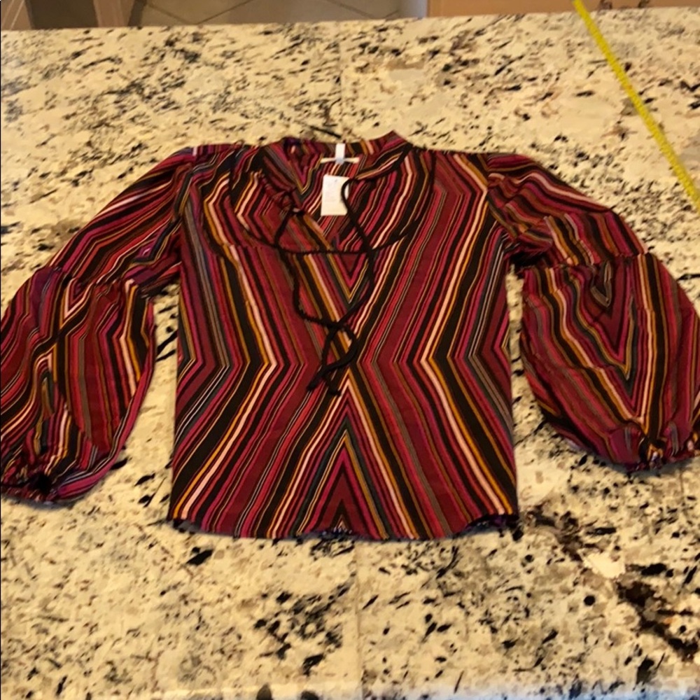 Flowing, peasant style blouse with flared sleeves